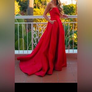 Red Sherri Hill ball gown with high slit.